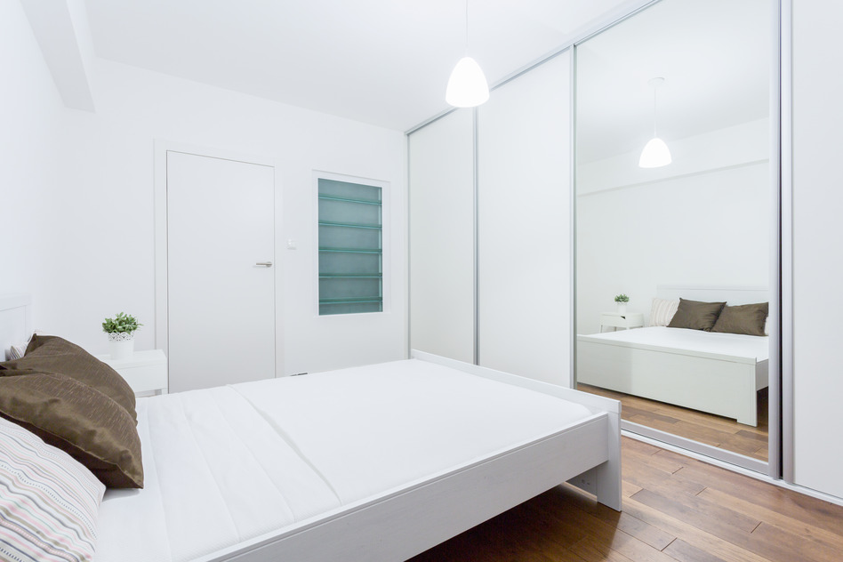 White bedroom in contemporary apartment